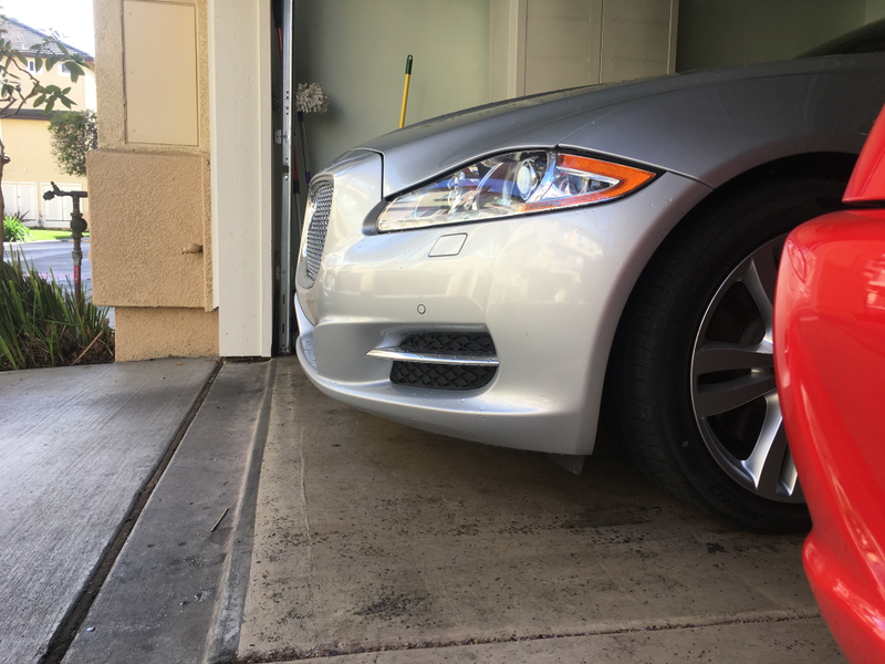 Meow barely fits in his den. One time it parked next to a Chevy Spark, whose rear end lines up with the Jag’s rear door handles.